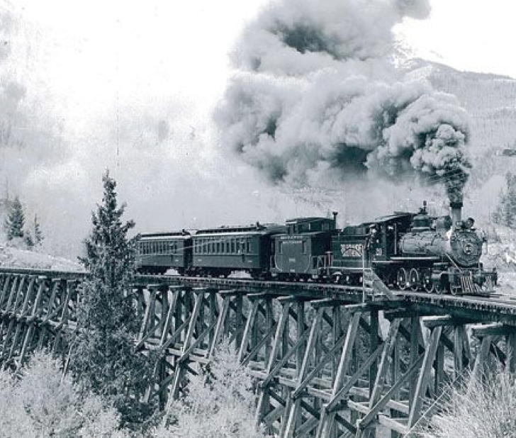 An old locomotive on a bridge